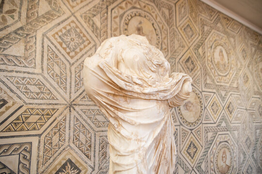 Rear View of a Draped Marble Statue