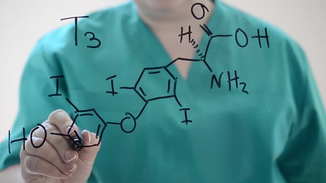 Doctor Writing Thyroxine T4 Chemical Formula on Glass for Endocrinology Concept