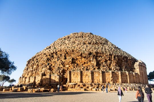 Visitors Dwarfed by the Royal Mausoleum's Scale
