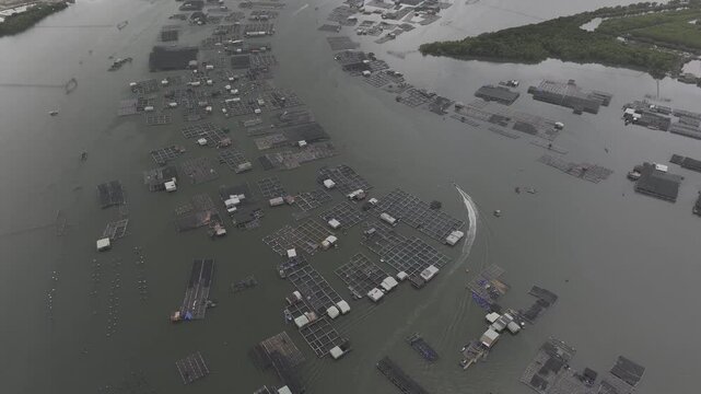 Aerial drone view of oyster farming rafts on the river in Long Son, near Ho Chi Minh City, Vietnam.