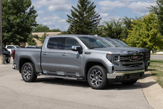 GMC Sierra 1500 SLT truck at a dealership. GMC offers the offers the Sierra 1500 with a 5.3L Ecotec3 DFM V8 engine. MY:2026