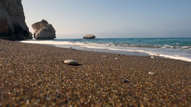  Aphrodite Rock sea stacks rising from the Mediterranean waters by a pebble beach in Cyprus