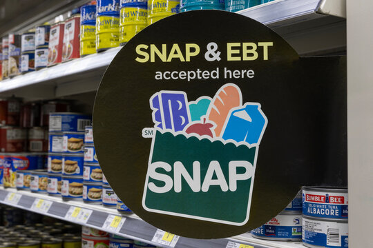 SNAP and EBT Accepted here sign. SNAP and Food Stamps provide benefits to help the budgets of disadvantaged families.