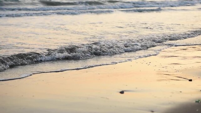   Sea waves and foam on a sandy beach, Cyprus 