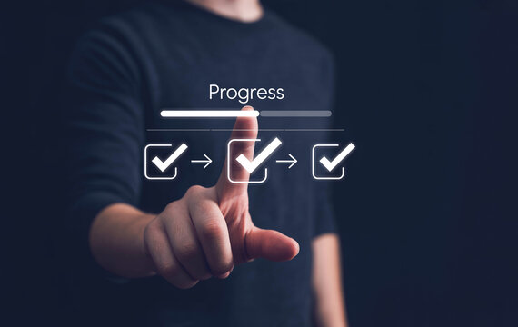 Businessman interacting with digital progress bar and completed task checklist interface.