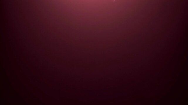 Elegant maroon stage lighting background with subtle volumetric light beams and dust particles