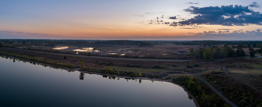 Elevated view over Crandell lake and new gravel quarry at sunrise