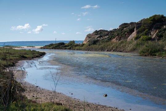 View of the Cachon River estuary flowing into the Atlantic Ocean near Cabo de la Plata in Zahara de los Atunes, Cadiz, Andalusia, Spain