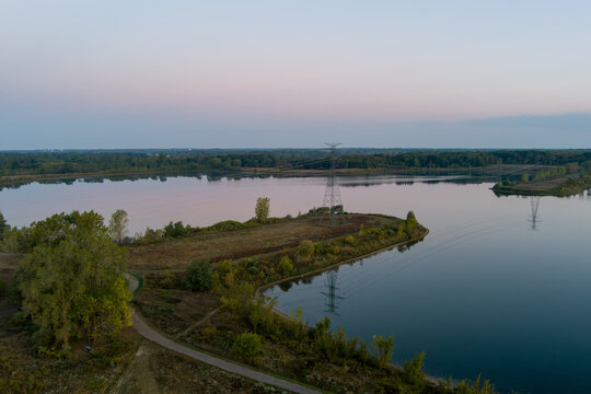 Power lines reflecting on Crandell lake water at dawn