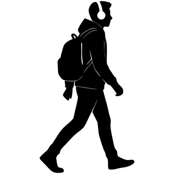 Silhouette of a young man with backpack and headphones walking, student or traveler urban lifestyle