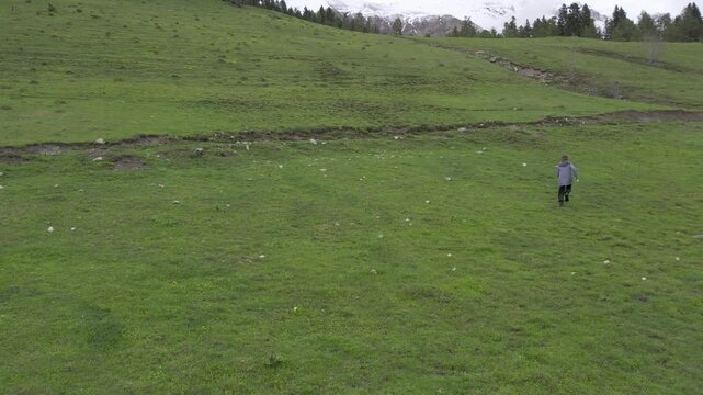 A drone video of the Caucasus Mountains, the Dzhily‑Su Valley, and the Pkhia Pass, Arkhyz, Russia, 2026.

