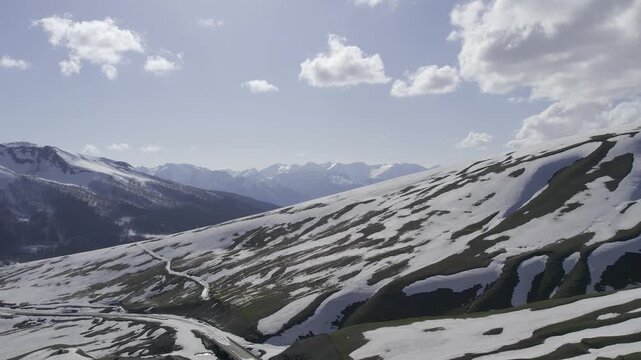 A drone video of the Caucasus Mountains, the Dzhily‑Su Valley, and the Pkhia Pass, Arkhyz, Russia, 2026.

