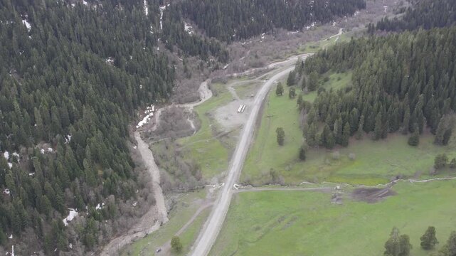 A drone video of the Caucasus Mountains, the Dzhily‑Su Valley, and the Pkhia Pass, Arkhyz, Russia, 2026.

