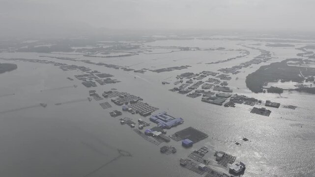 Aerial drone view of oyster farming rafts on the river in Long Son, near Ho Chi Minh City, Vietnam.