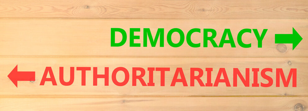 Democracy or authoritarianism words symbol. Concept words Democracy Authoritarianism on beautiful wooden wall. Beautiful wooden wall background. Business democracy authoritarianism concept. Copy space