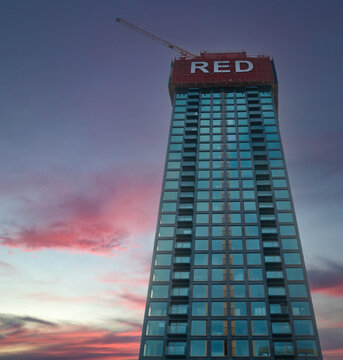 Rotterdam, The Netherlands. 08,07,2026. Modern High Rise Building at Sunset