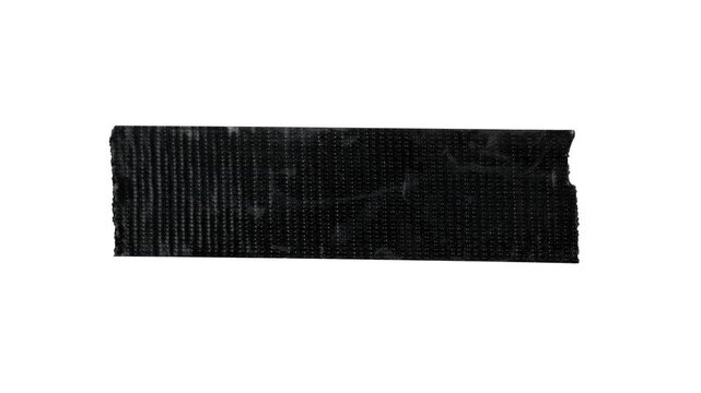 Animated black duct tape on a black screen background, crumpled tape texture reveal, stop motion collage element with alpha channel.