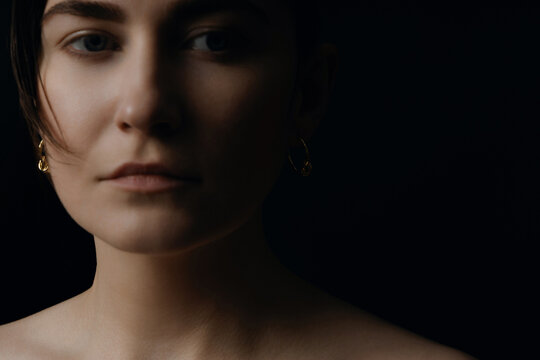 Blurred Portrait Minimalist Gold Earrings Black Studio Background
