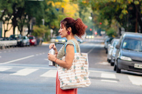 Woman crossing avenue in Buenos Aires