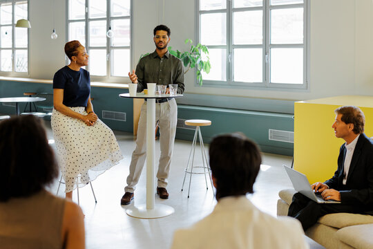 Diverse team discussing business ideas in modern office