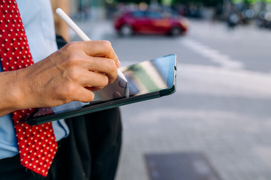 Man's hands with a tablet