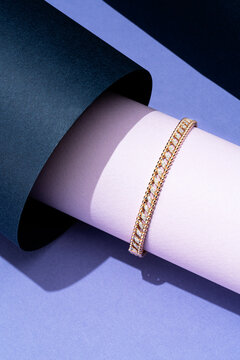 Gold Twisted Bracelet on Geometric Purple Display