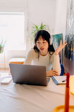 A woman using a laptop at home