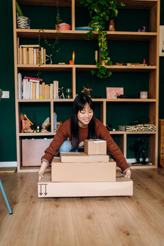 A woman with boxes in her hands
