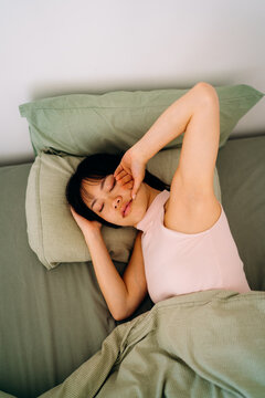 A woman sleeping in a bed