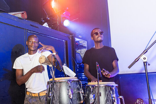 African percussionists performing live music on stage