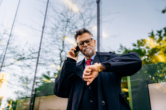 A man talking on a mobile phone in the city