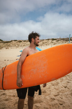 Man holding a surfboard 