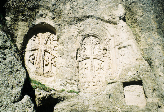 Carved Stone Crosses on a Rock Face in a Historical Site
