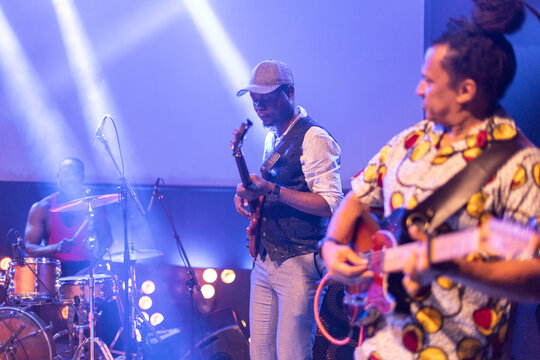 Band playing vibrant music during a live concert