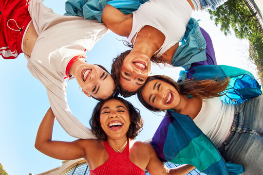 Friends enjoy a sunny day together in a circle
