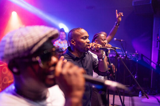 African american men performing live music on stage