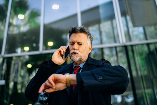 A man talking on a mobile phone in the city