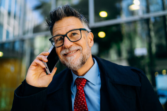A man talking on a mobile phone in the city