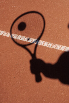 Tennis Player Gets Ready to Hit the Ball on Clay Court