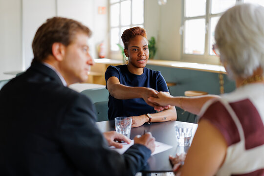 Candidate shaking hands at successful job interview