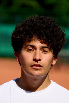 Portrait of a Young Man on Tennis Court During Sunny Day
