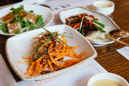 Authentic Korean Banchan Side Dishes on a Wooden Table
