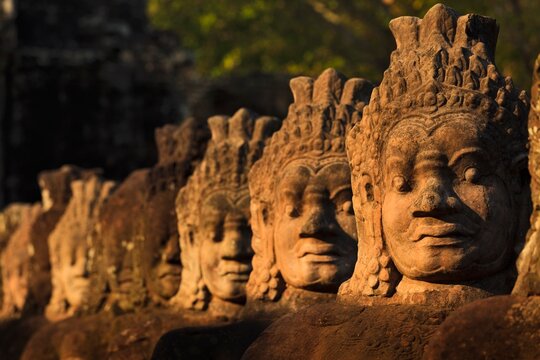 Ancient stone guardians illuminated by golden morning light