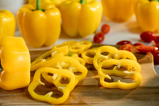 Slices of yellow peppers on table