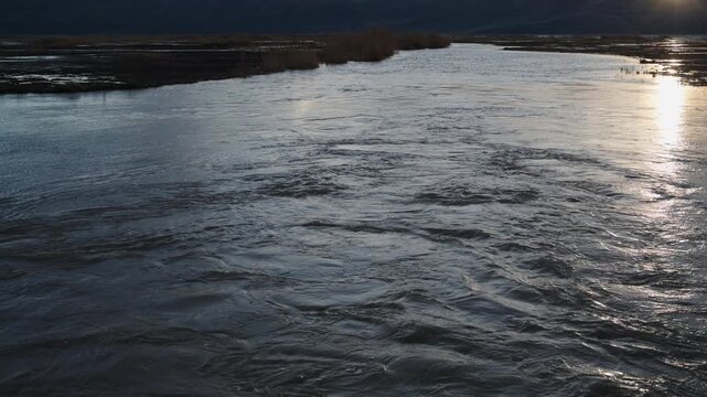 Water moves through a culvert on the Bear River in the Bear River Migratory Bird Refuge, Corrine Utah.