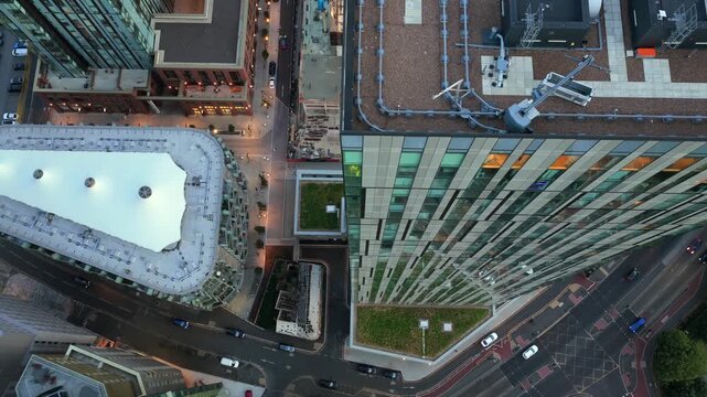Top-down Aerial View of Greengate Tower Rooftop, Abito Building, and Trinity Way Junction in Salford UK  at Dusk