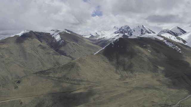A drone video of the Caucasus Mountains, the Dzhily‑Su Valley, and the Pkhia Pass, Arkhyz, Russia, 2026.

