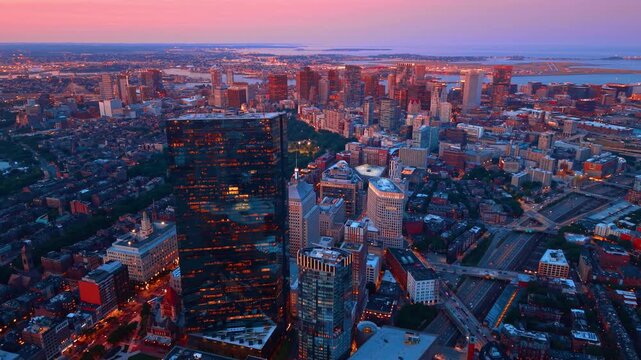 Scenery of the thriving city at the time of sunset. Approaching the glossy dark 200 Clarendon skyscraper in Boston, Massachusetts, USA.
