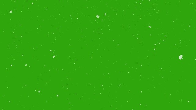 Falling snow particles add charm to a vibrant green background with film grain, perfect for winterthemed digital designs.