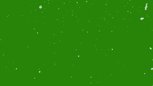 Winter snow particle elements on a vibrant green background for festive designs suitable for winterthemed projects, holiday banners, and christmas cards.
